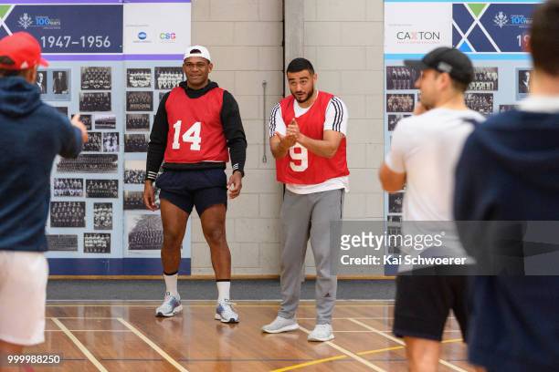 Seta Tamanivalu and Bryn Hall react during a Crusaders Super Rugby training session at St Andrew's College on July 16, 2018 in Christchurch, New...