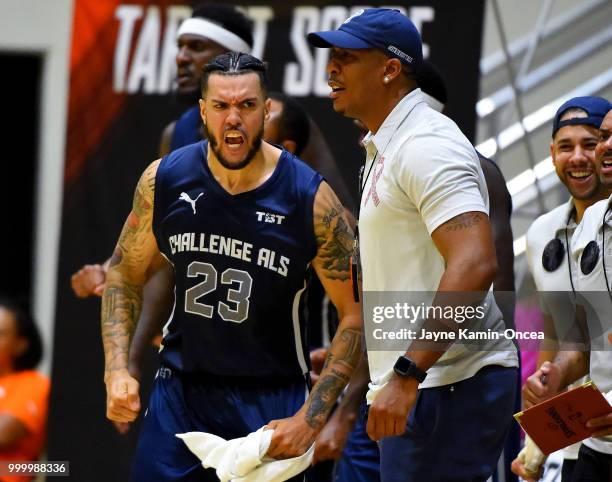 Assistant coach Johnny Dukes and Sean Marshall of Team Challenge ALS react to a basket on the bench during the Western Regional of The Basketball...