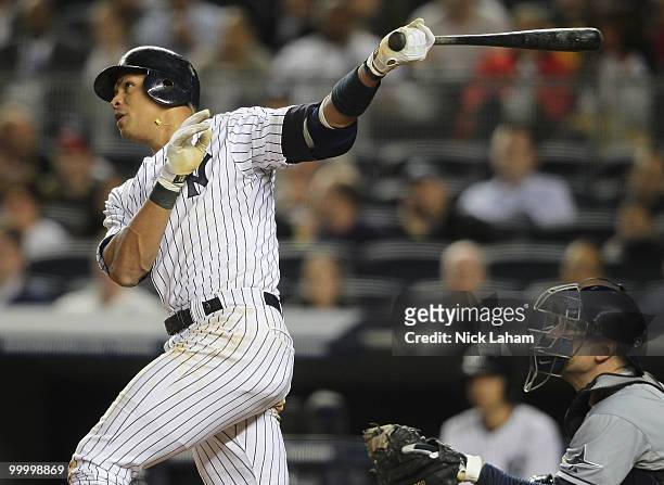 Alex Rodriguez of the New York Yankees hits a solo home run in the sixth inning against the Tampa Bay Rays at Yankee Stadium on May 19, 2010 in the...