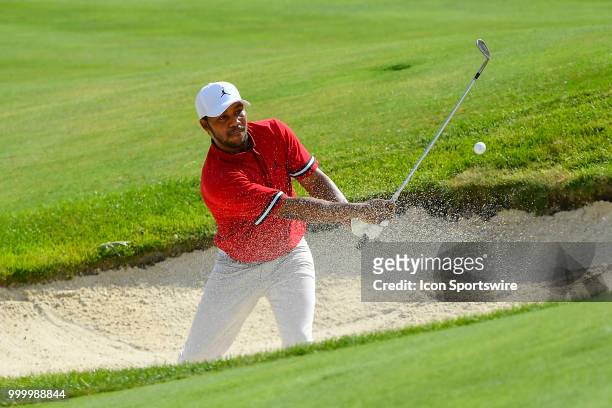 Harold Varner III hits a shot from the sand on the 17th hole during the final round of the John Deere Classic on July 15, 2018 at the TPC Deere Run...