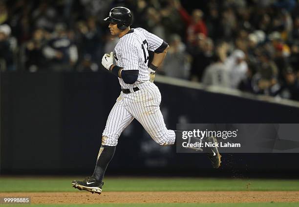 Alex Rodriguez of the New York Yankees rounds the bases after hitting a solo home run in the sixth inning against the Tampa Bay Rays at Yankee...