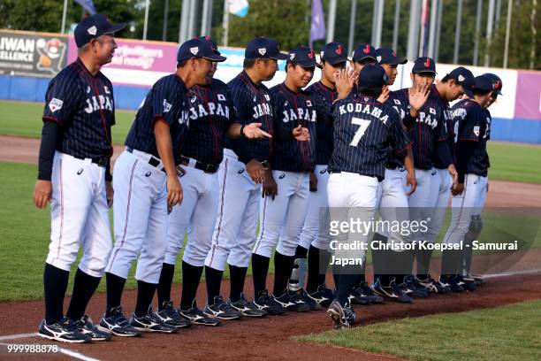 The team of Japan enters the pitch to the Haarlem Baseball Week game between Cuba and Japan at Pim Mulier Stadion on July 15, 2018 in Haarlem,...