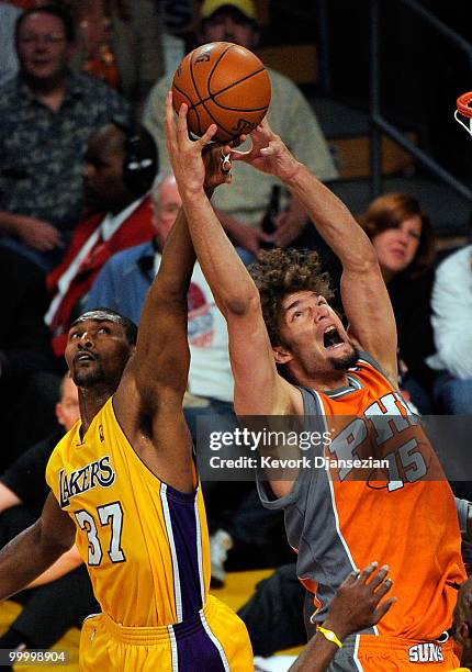 Ron Artest of the Los Angeles Lakers knocks the ball out of the hands of Robin Lopez of the Phoenix Suns as they go up for a rebound during the...