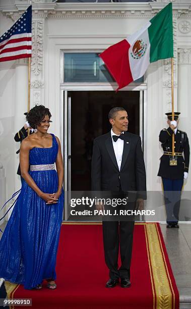 First Lady Michelle Obama and US President Barack Obama wait for the arrival of the Mexican President and Mexican First Lady on May 19, 2010 on the...