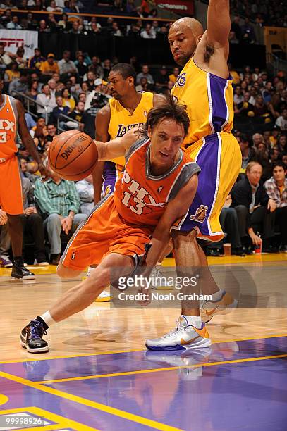 Steve Nash of the Phoenix Suns drives along the baseline against Derek Fisher of the Los Angeles Lakers in Game Two of the Western Conference Finals...