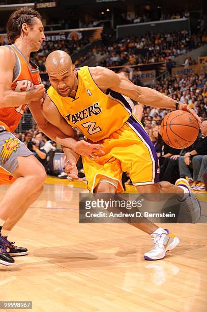 Derek Fisher of the Los Angeles Lakers dribbles against Steve Nash of the Phoenix Suns in Game Two of the Western Conference Finals during the 2010...
