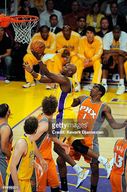 Lamar Odom of the Los Angeles Lakers scores on a layup against Amar'e Stoudemire of the Phoenix Suns during the second quarter in Game Two of the...