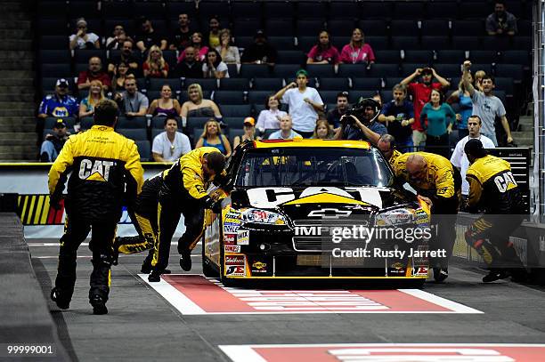 The Caterpillar Chevrolet pit crew races The FedEx Freight Toyota pit crew in the finals of the NASCAR Sprint Pit Crew Challenge at Time Warner Cable...