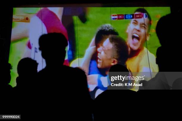 France wins the Russia 2018 FIFA World Cup and children celebrate this when they watch on a projector screen at the street in Dhaka.