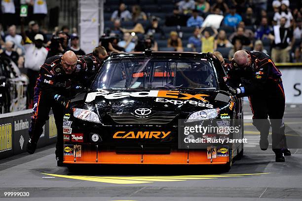 The FedEx Freight Toyota pit crew races the Caterpillar Chevrolet pit crew in the finals of the NASCAR Sprint Pit Crew Challenge at Time Warner Cable...