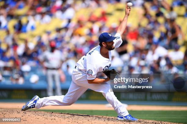 Clayton Kershaw of the Los Angeles Dodgers pitchs during the MLB game against the Los Angeles Angels at Dodger Stadium on July 15, 2018 in Los...