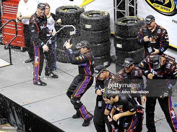 The FedEx Freight Toyota pit crew celebrate after defeating the Caterpillar Chevrolet pit crew in the finals of the NASCAR Sprint Pit Crew Challenge...