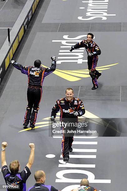 The FedEx Freight Toyota pit crew celebrate after defeating the Caterpillar Chevrolet pit crew in the finals of the NASCAR Sprint Pit Crew Challenge...