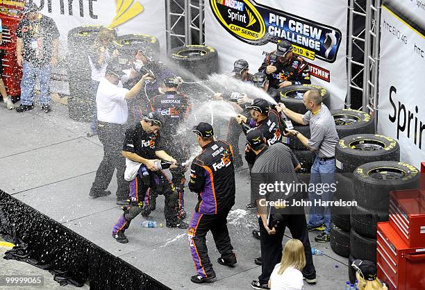 The FedEx Freight Toyota pit crew celebrate after defeating the Caterpillar Chevrolet pit crew in the finals of the NASCAR Sprint Pit Crew Challenge...