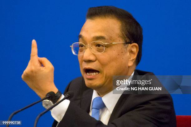 China's Premier Li Keqiang speaks during the China-EU Business Roundtable at the Great Hall of the People in Beijing on July 16, 2018.