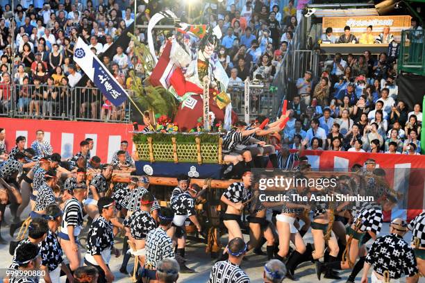 The fourth Doi Nagare members runs with float called 'Yamakasa' during the 'Oiyama' race through Seido Street of Kushidajinja Shrine during the...