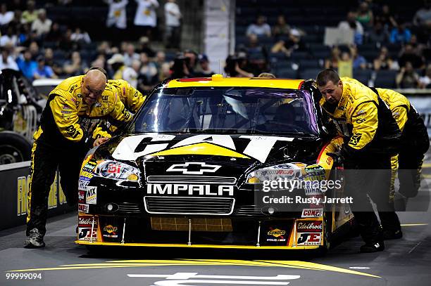 The Caterpillar Chevrolet pit crew race during the NASCAR Sprint Pit Crew Challenge at Time Warner Cable Arena on May 19, 2010 in Charlotte, North...