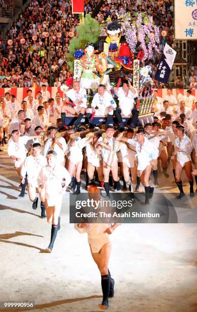 The second Chiyo Nagare members runs with float called 'Yamakasa' during the 'Oiyama' race through Seido Street of Kushidajinja Shrine during the...