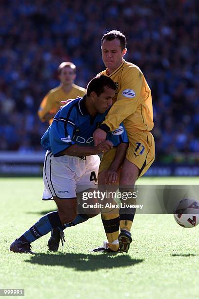 Kevin Cooper of Wimbledon holds up Ali Benarbia of Man City during the Nationwide Division One game between Manchester City and Wimbledon at Maine...