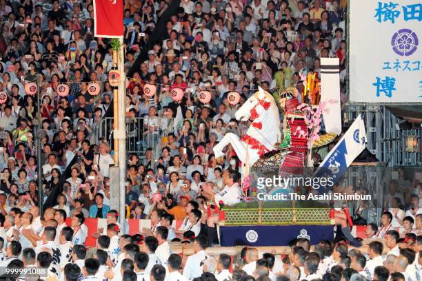 The first Nishi Nagare members runs with float called 'Yamakasa' during the 'Oiyama' race through Seido Street of Kushidajinja Shrine during the...