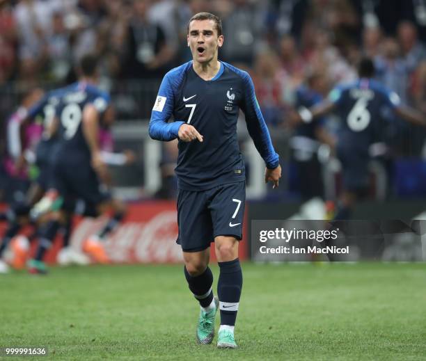 Antoine Griezmann of France celebrates after Paul Pogba of France scores during the 2018 FIFA World Cup Russia Final between France and Croatia at...