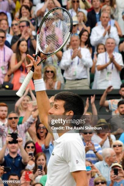 Novak Djokovic of Serbia celebrates his victory over Rafael Nadal of Spain after their Men's Singles semi-final on day twelve of the Wimbledon Lawn...