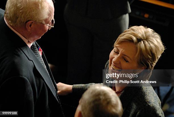 Senator Hillary Clinton, D-Ny, talks with members on the floor of the House before Nuri al-Maliki, Prime Minister of Iraq, delivers a speech to a...