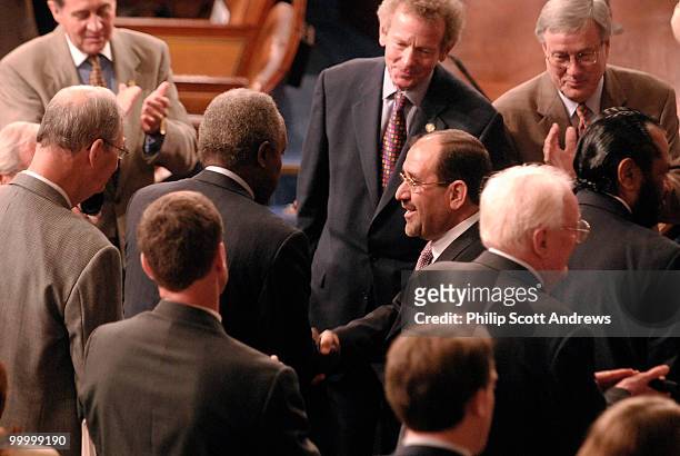 Nuri al-Maliki, Prime Minister of Iraq, shakes hands before delivering a speech on Iraq to a joint session of Congress.