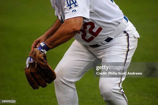 Rep. Joe Baca, the Democrats Pitcher, plays catch during the Democratic warm up session before the game