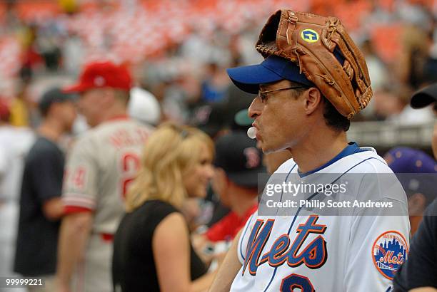 Rep. Anthony Weiner, D-Ny, blows bubblegum as he waits for the start of this years game, last year Weiner went 0-2.