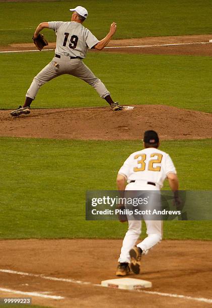 Rep. John Shimkus, R-Ill, carries out his duties as the republican pitcher while Rep. Kenny Hulshof R-Mo. Covers first.