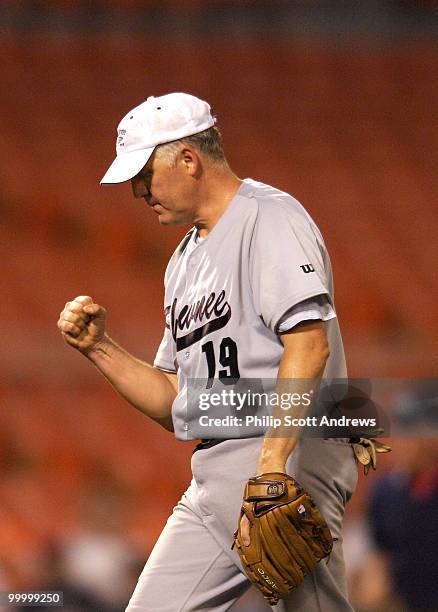 Rep. John Shimkus, R-Ill, pumps his fist after throwing out the last democratic batter and winning the game.