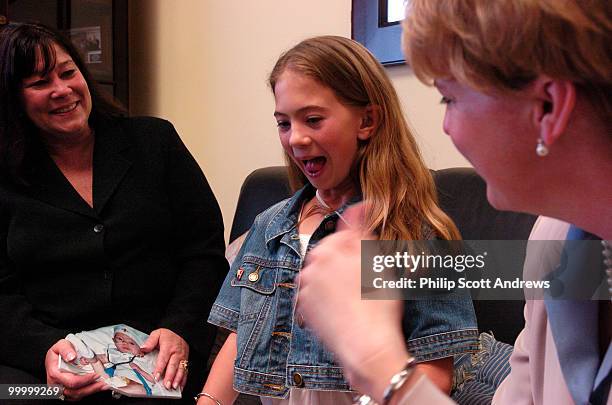 Elizabeth Amato sits with her mother, Colleen Amato, and Melissa Bean, . Amato came to Washington last Wednesday to lobby congress to support...