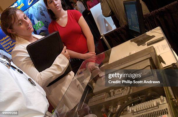 Richelle Rosenbaum learns about the benefits of fuel cell power at a seminar held in the Cannon House Office Building.