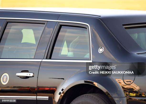 First Lady Melania Trump waves from the car after arriving at Helsinki-Vantaa Airport in Helsinki, on July 15, 2018 on the eve of a summit in...