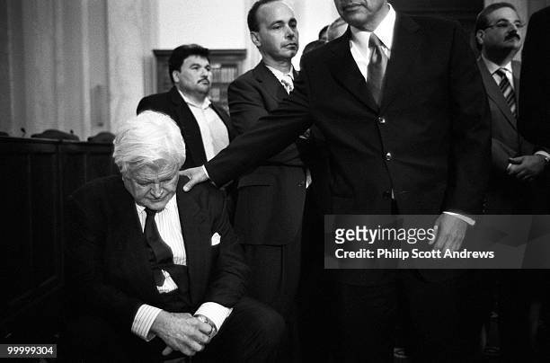 Sen. Edward Kennedy, D-Mass, is patted on the back during a press conference in which he tried to gain support for comprehensive immigration...