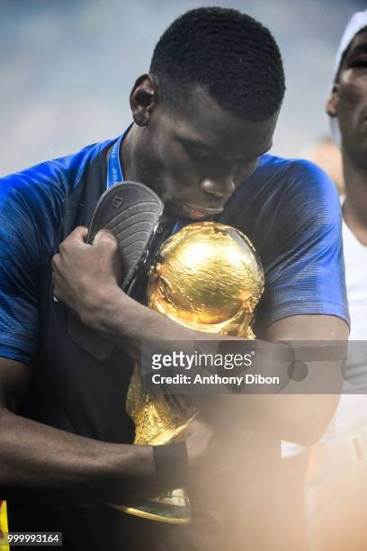 Paul Pogba of France kisses the trophy during the World Cup Final match between France and Croatia at Luzhniki Stadium on July 15, 2018 in Moscow,...