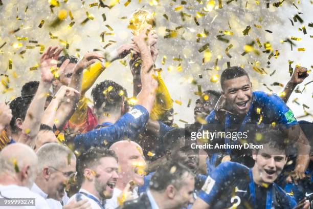 Team of France and Kylian Mbappe celebrate the victory with the trophy during the World Cup Final match between France and Croatia at Luzhniki...
