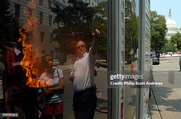 Brian Sampsel of State College, PA talks to Capitol Hill interns about fire safety during a controled burn on Capitol Hill