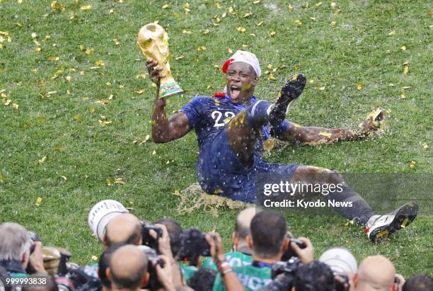 Benjamin Mendy of France celebrates with the World Cup trophy after France's 4-2 victory against Croatia in the final to win the country's second...