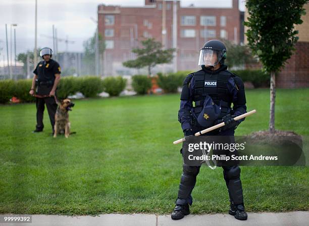 Riot clad police stand guard outside the Ramsey County Jail along a protest march route. The jail is currently housing some of the protestors...