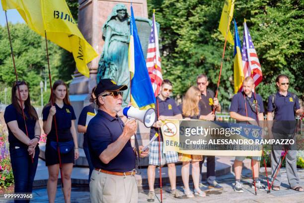 Small group of Ukrainian people stage a protest against Russia on early July 16 in the Esplanadi park in Helsinki, Finland, some hours ahead of the...
