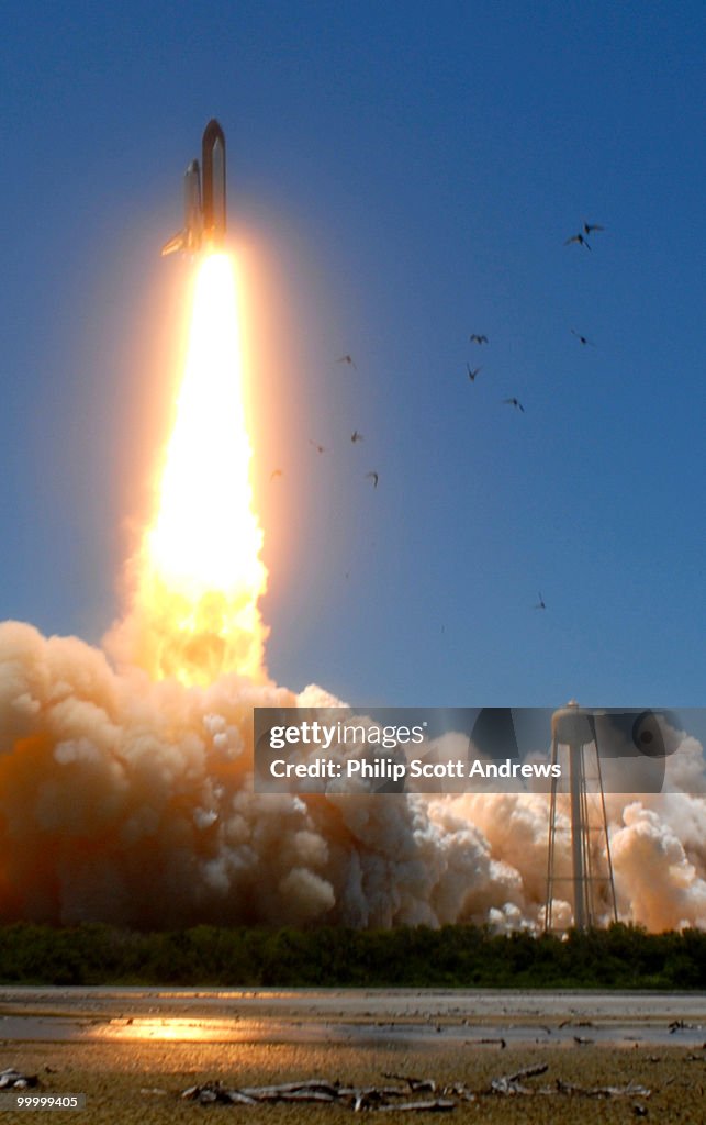 The Space Shuttle Discovery lifts