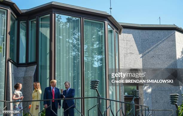 President Donald Trump and First Lady Melania Trump pose with Finnish President Sauli Niinisto and his wife Jenni Haukio at the Mantyniemi...