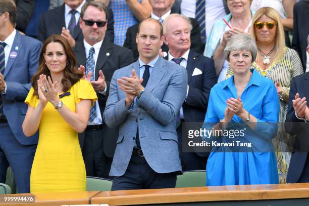 Catherine, Duchess of Cambridge, Prince William, Duke of Cambridge and Prime Minister Theresa May attend the men's single final on day thirteen of...