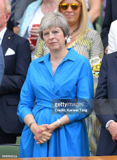 Prime Minister Theresa May attends the men's single final on day thirteen of the Wimbledon Tennis Championships at the All England Lawn Tennis and...