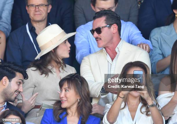 Emma Watson and Luke Evans attend the men's single final on day thirteen of the Wimbledon Tennis Championships at the All England Lawn Tennis and...