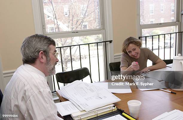 Jill Downing, Executive Director of the BRMS , jokes with Kenneth Laden, Assoc. Director of Planning, D.C. Dept. Of Transportation, during a meeting...