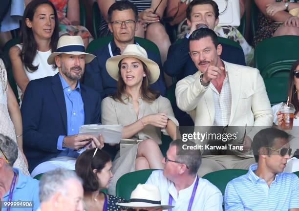 John Vosler, Emma Watson and Luke Evans attend the men's single final on day thirteen of the Wimbledon Tennis Championships at the All England Lawn...