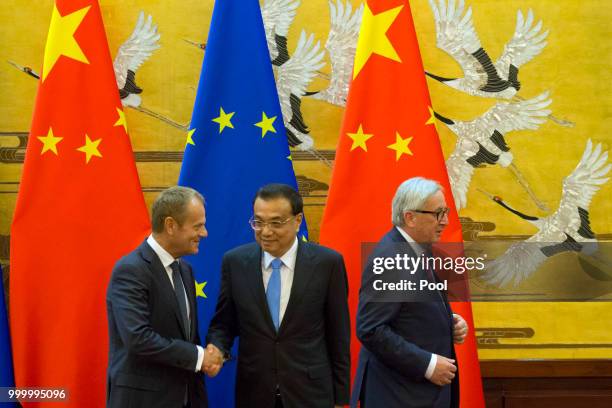 European Council President Donald Tusk, Chinese Premier Li Keqiang and European Commission President Jean-Claude Juncker attend a joint press...